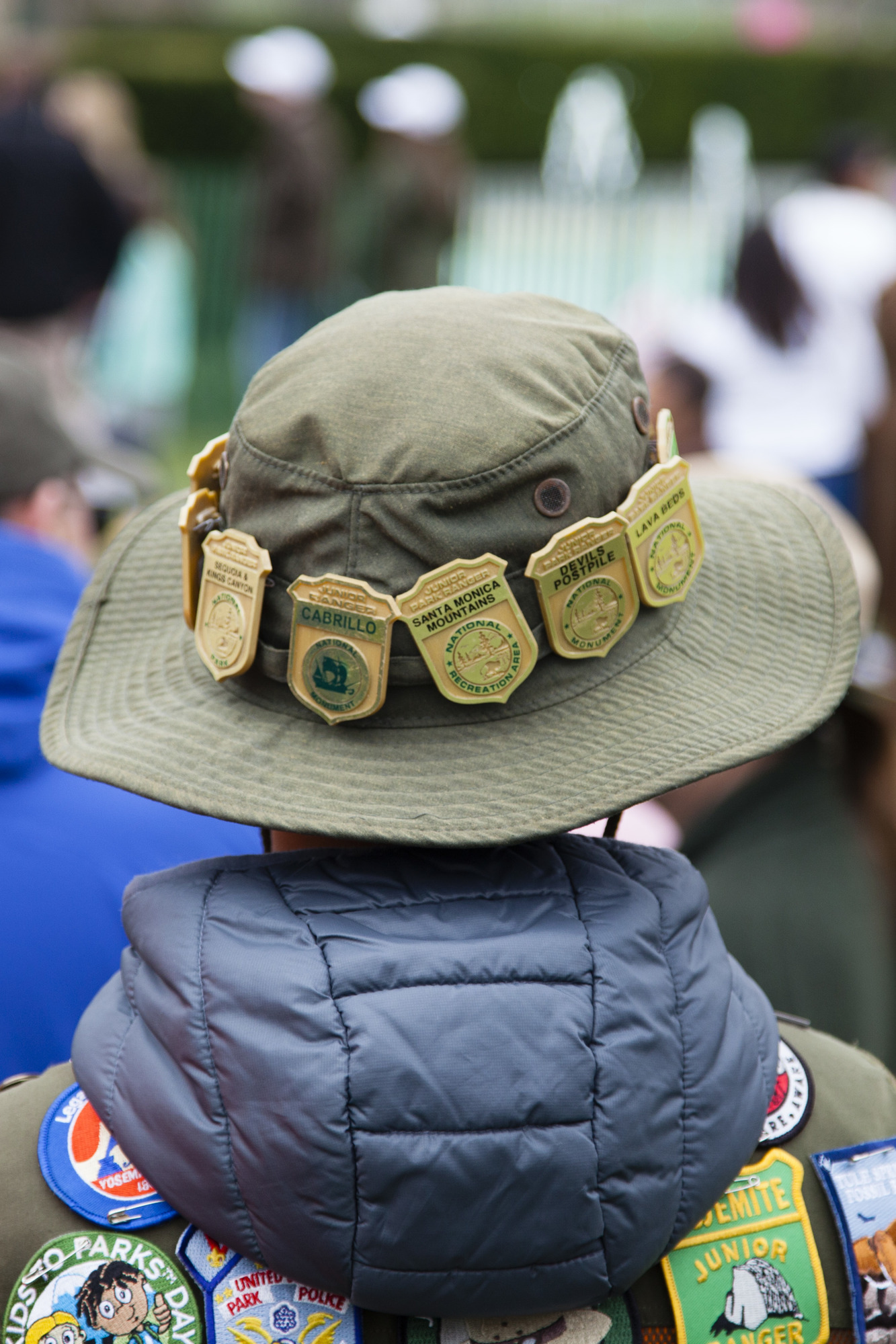 A Junior Ranger showcases his badges from across the country.
