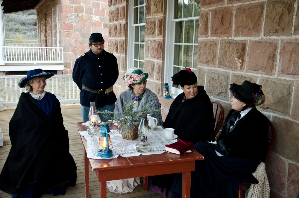 A group of five reenactors discussing 1880s presidential election