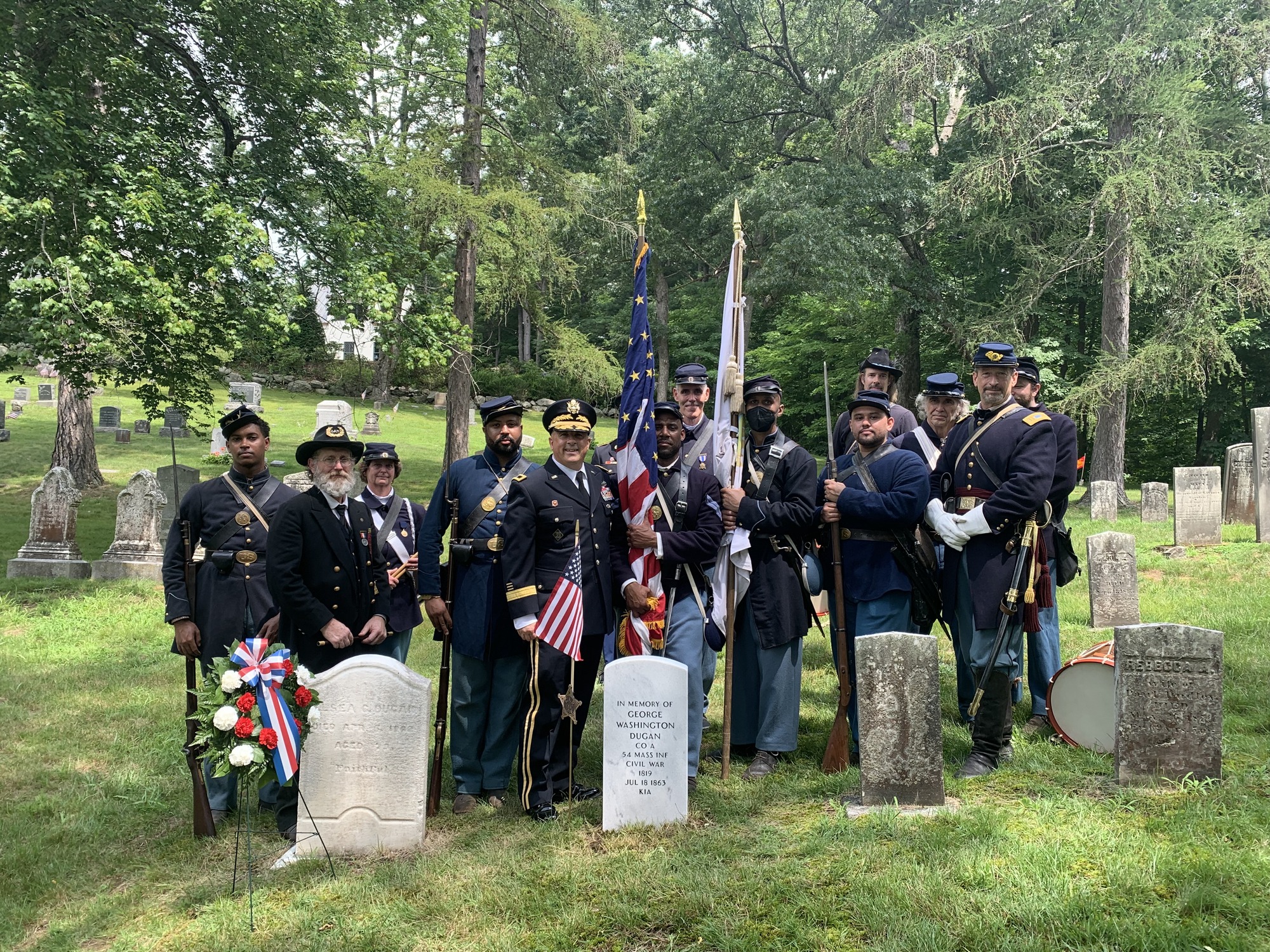 Cemetery Ceremony at the graveside of George Washington Dugan, 54th Mass Regiment.  Civil War reenactors honoring a African-American hero. 