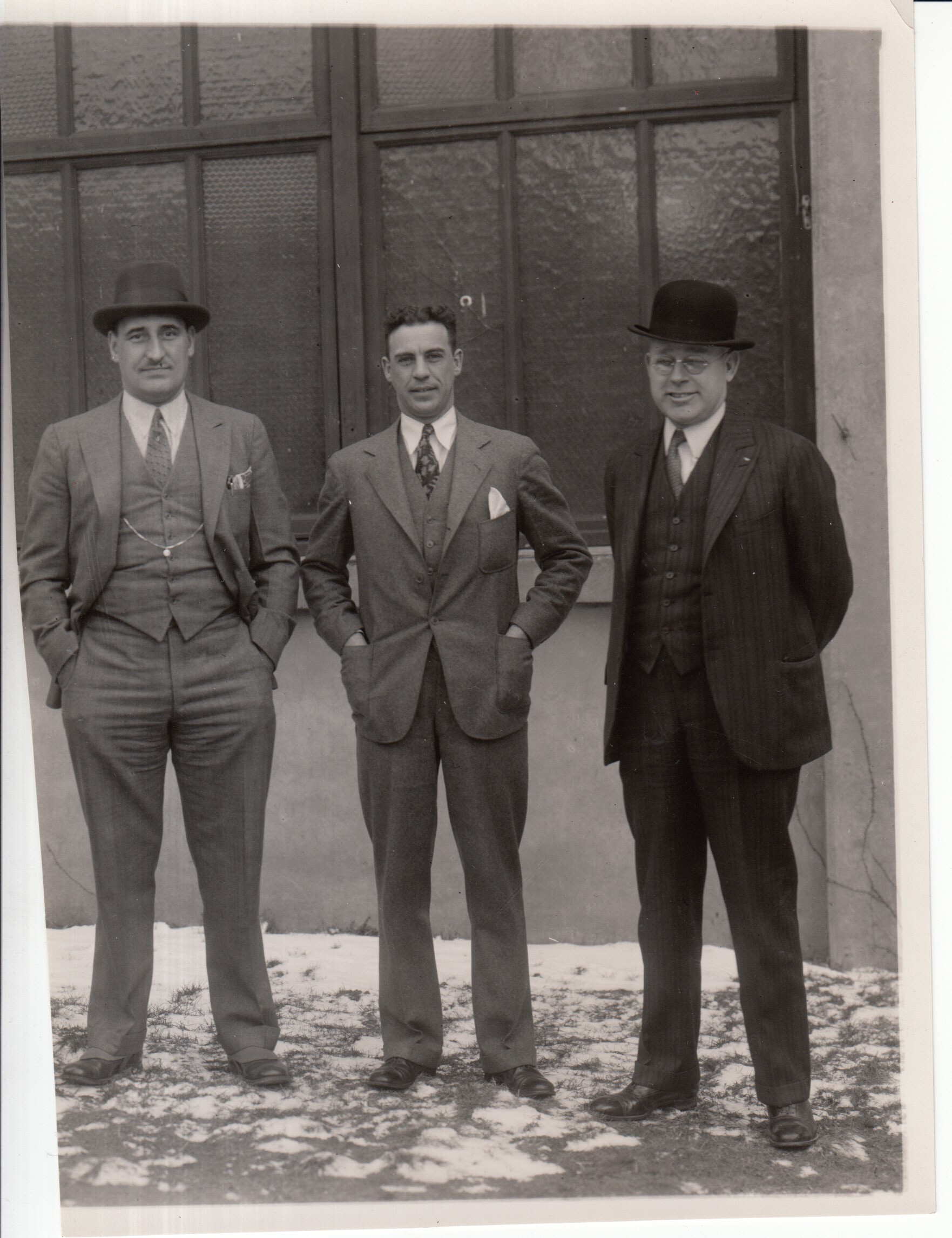 Three unidentified Edison employees.