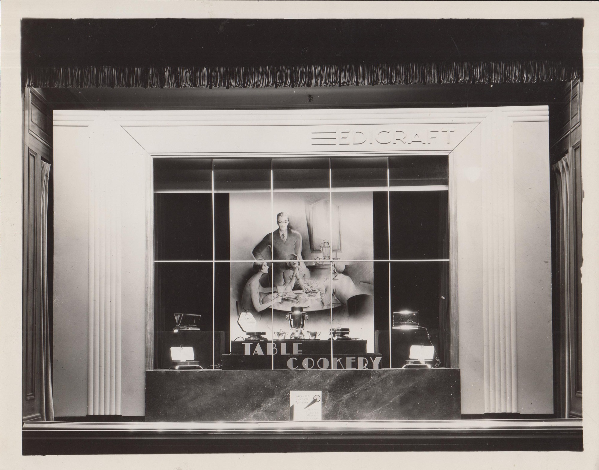 Edicraft exhibit, "Table Cookery," with products arranged in window display.