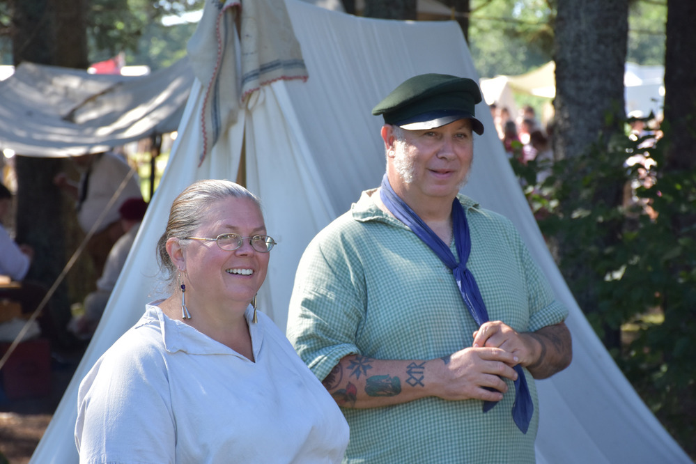 Reenactor couple in front of tent