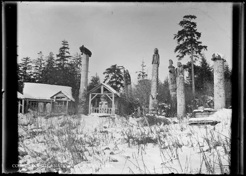 Totem poles and other large carvings in Old Kasaan.