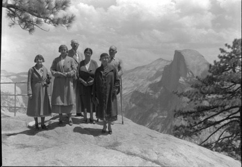 American Legion Auxilliary party at Glacier Point. L to R: Mrs. Butts, Yosemit; Mrs. Sutherland, Yosemitel Colonel Chas W. Decker; Los Angeles; Mrs. Chas. Decker, Pres. Aux. 1923; Mrs. Milo D. Aylward, Pres. 1934; Milo D. Aylward, 616 Charter Oak St; South Pasadena, CA.