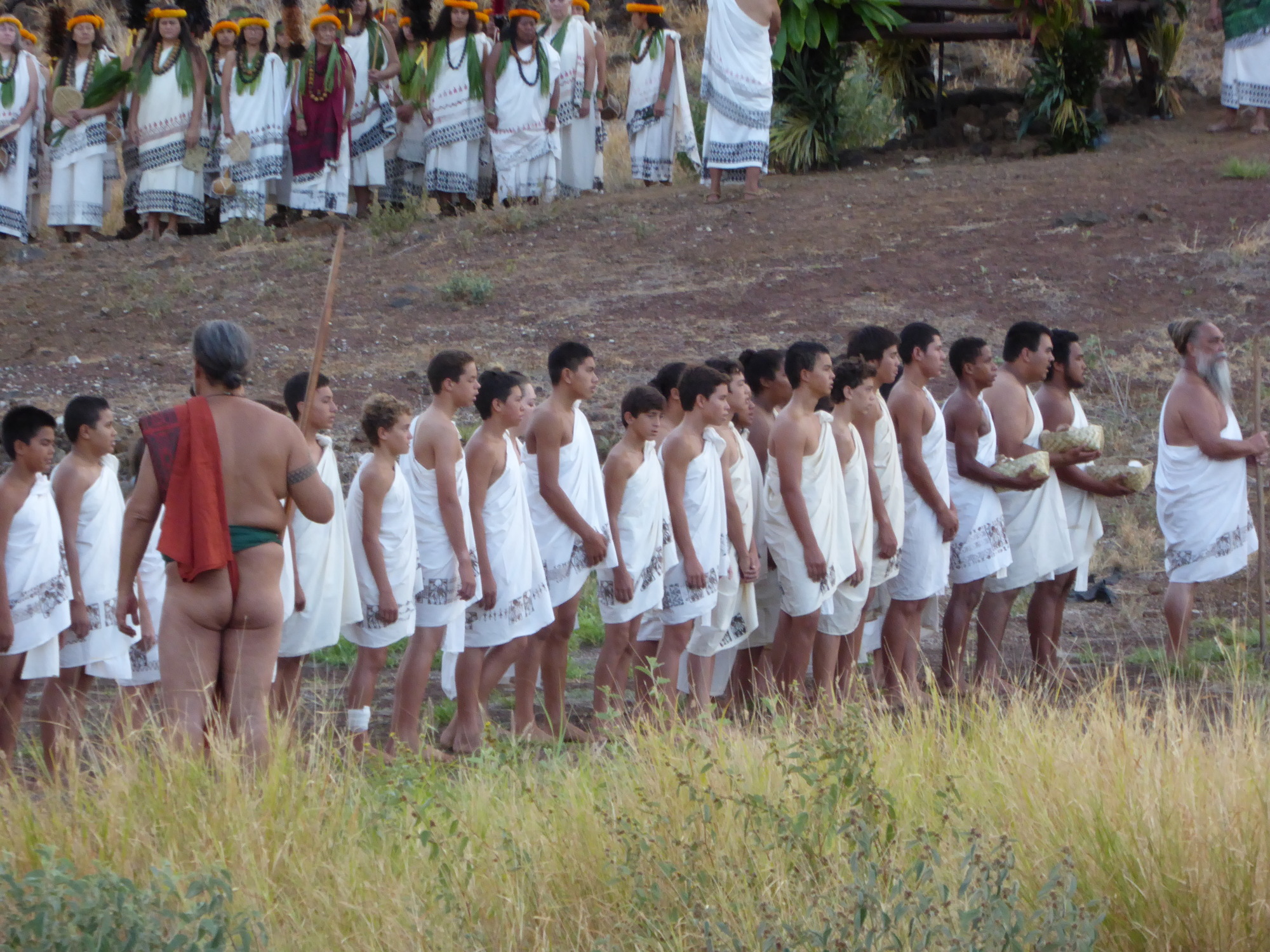Grade school keiki presenting their ho'okupu with an oli to the ali'i.