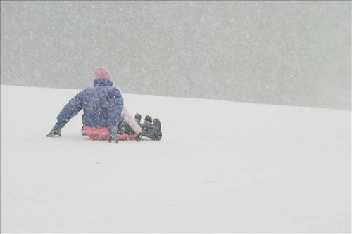 Sledding at Kendall Hills Adult and Child
