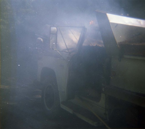 Color photo of an engine fire in a pickup.
