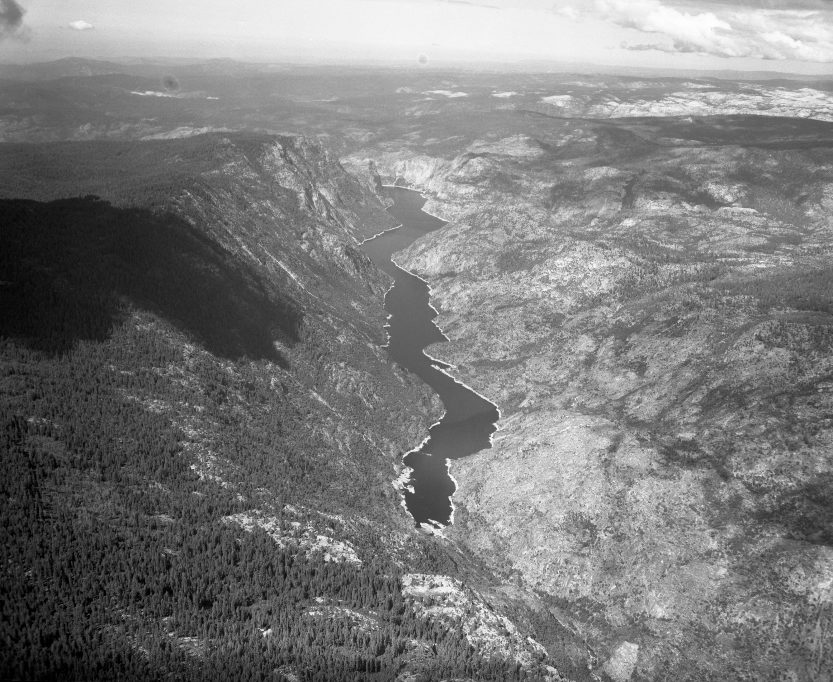 Aerial photograph of Hetch Hetchy Reservoir from flight over park.