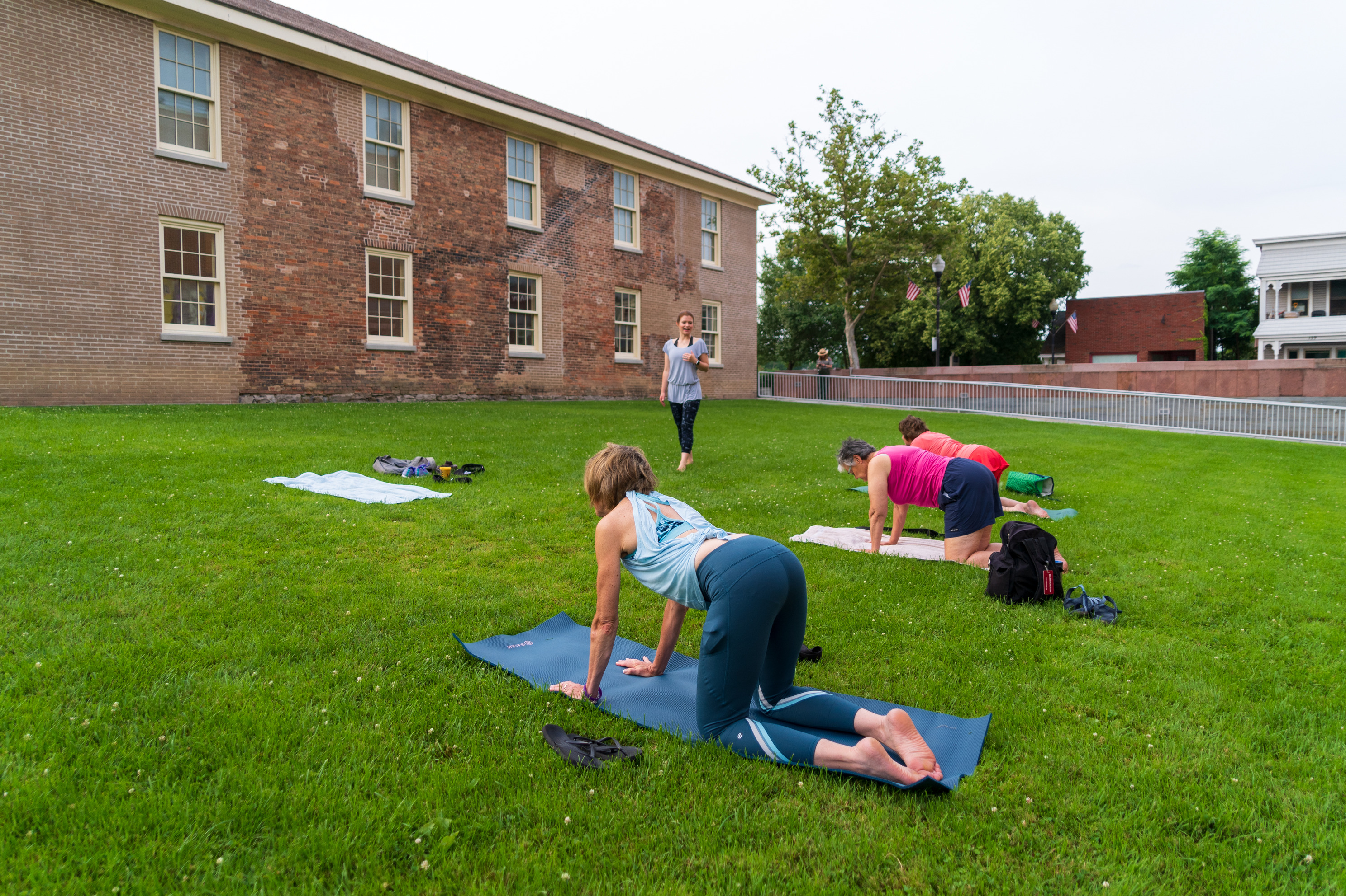 A yoga event on a lawn.
