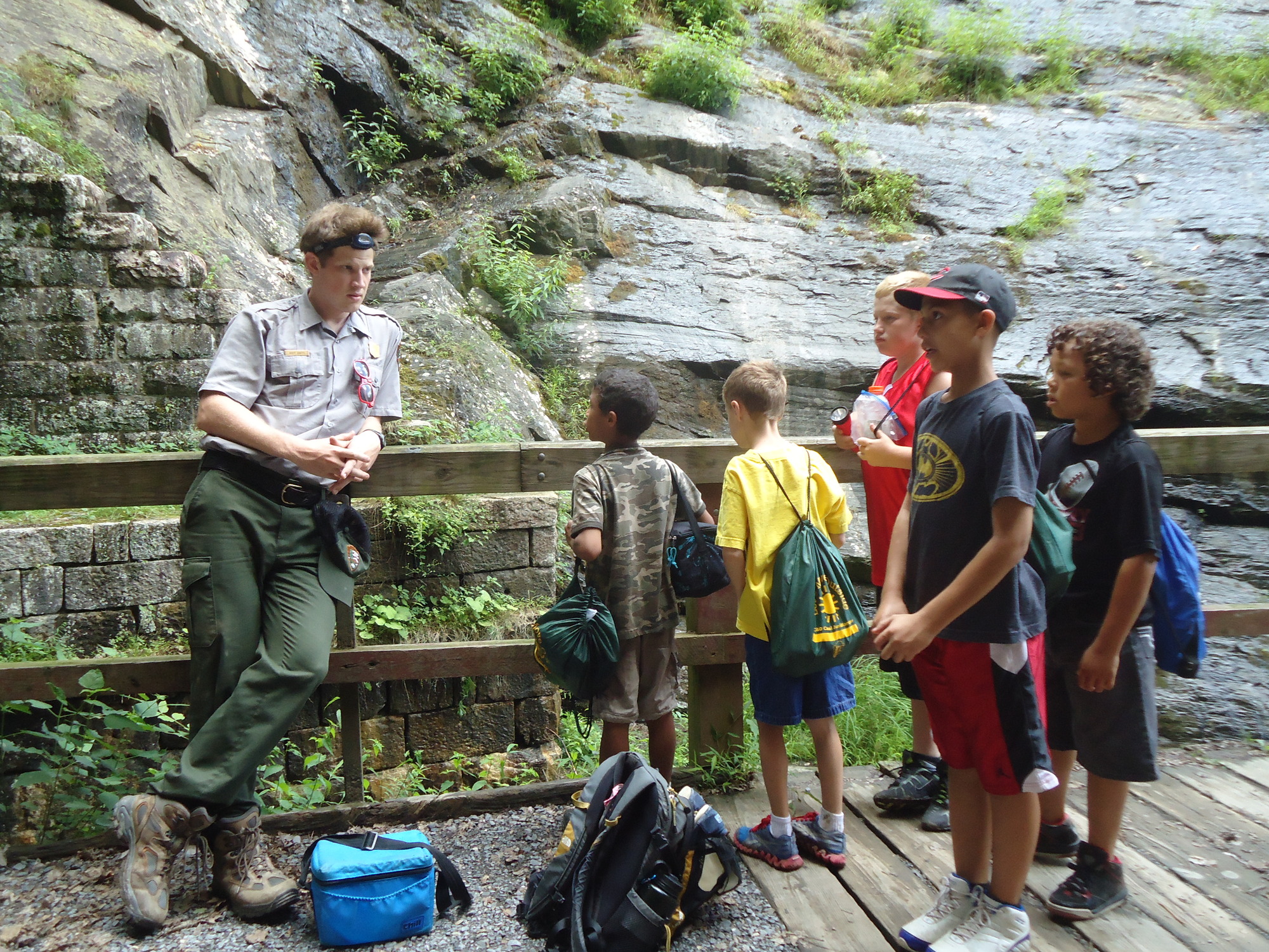 Youth with a Park Ranger during a hike.