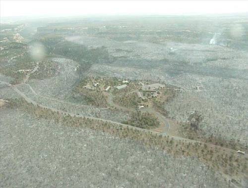 Aerial views of Chapin Mesa area in and around buildings depicting burn areas in the aftermath of the Long Mesa Fire at Mesa Verde National Park, August 2002