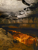 Stairs lead further down in the cave. 