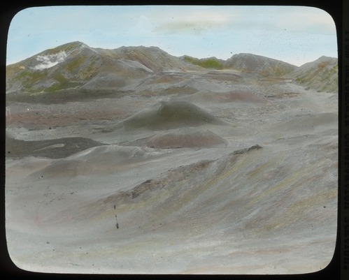 An old  hand-painted photo of cindercones at the summit of Haleakalā volcano on Maui