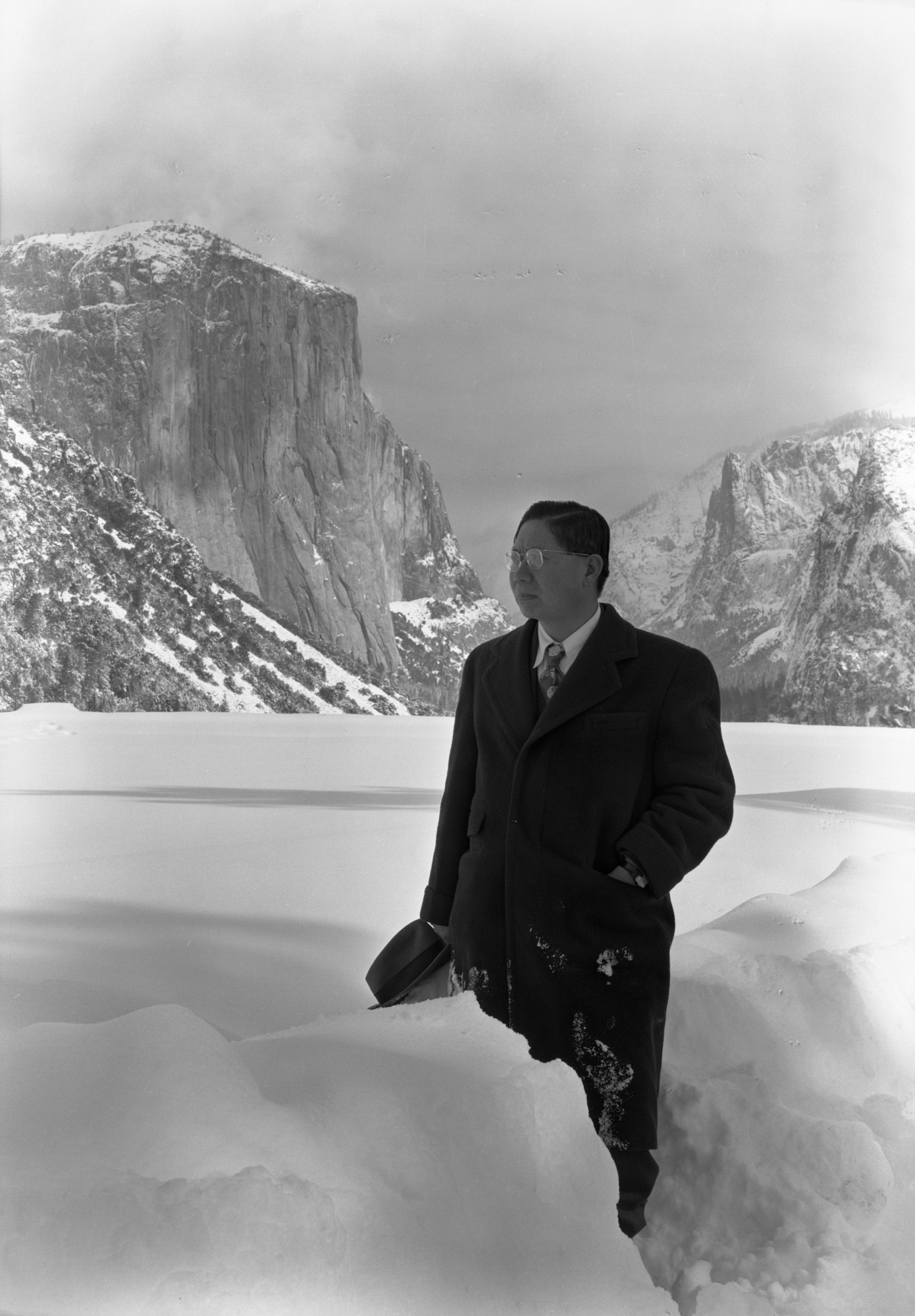 Dr. Huan-Kang Fu, at the Wawona Tunnel. "Dr. Fu, distinguished representative of the Chinese Government, who has been visiting America, photographed at Yosemite National Park, where he made a study of national park administration in view of promoting the establishment of national parks in China."