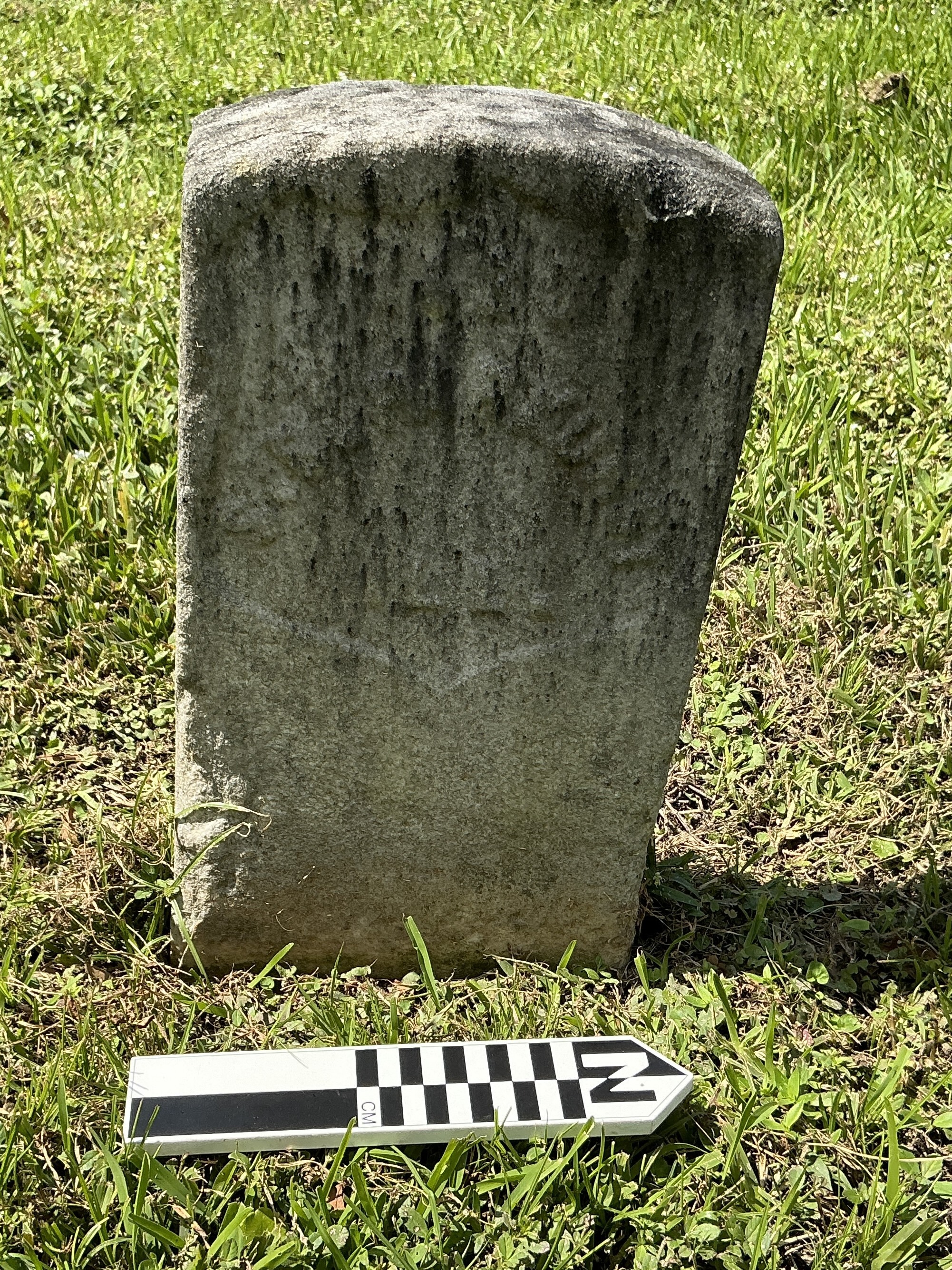 Extra image of historic upright marble headstone with recessed shield face.