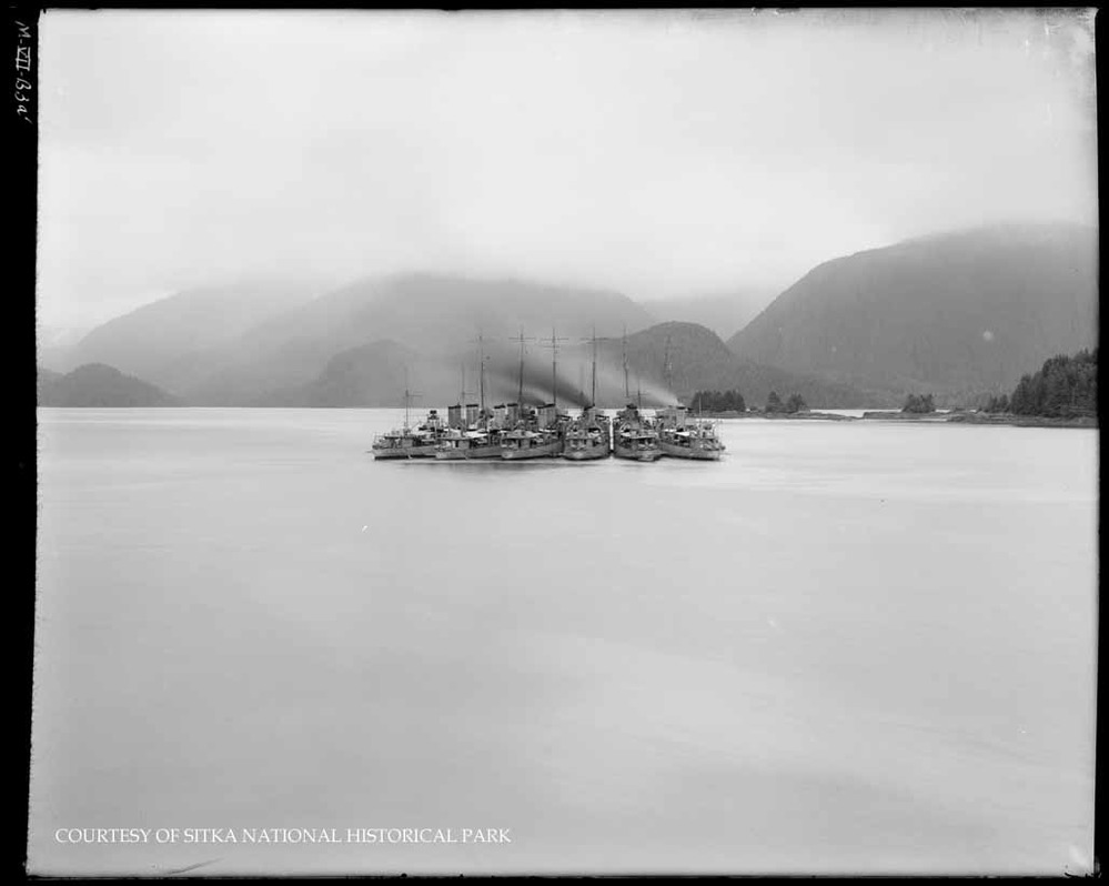 Small boat upright on land.