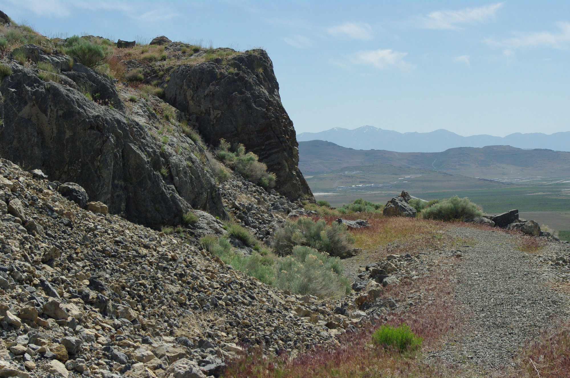 Rocks have tumbled down and narrowed the Union Pacific grade. 