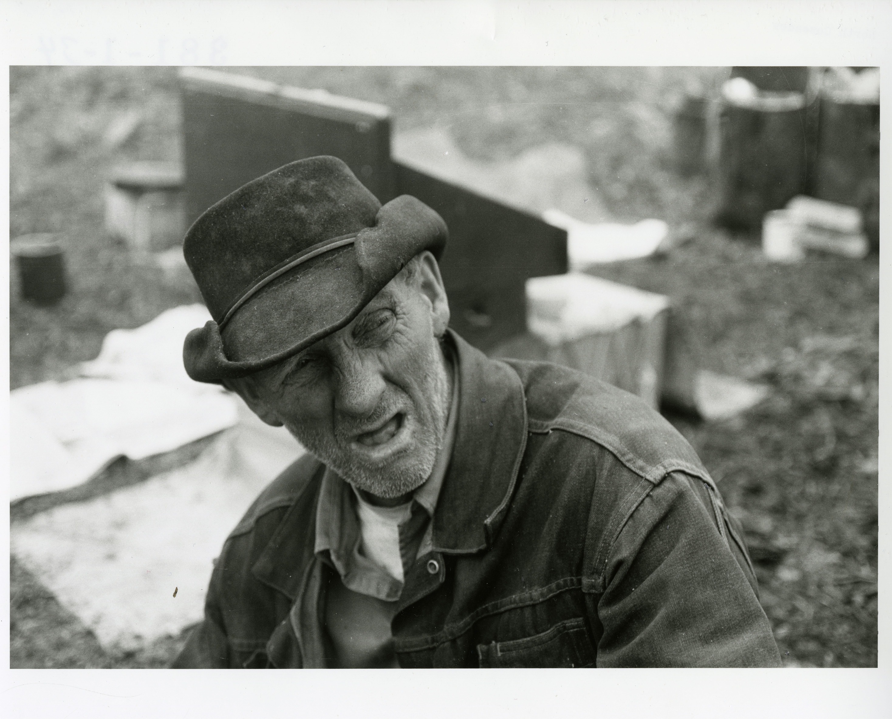 An elderly man wearing a hat.