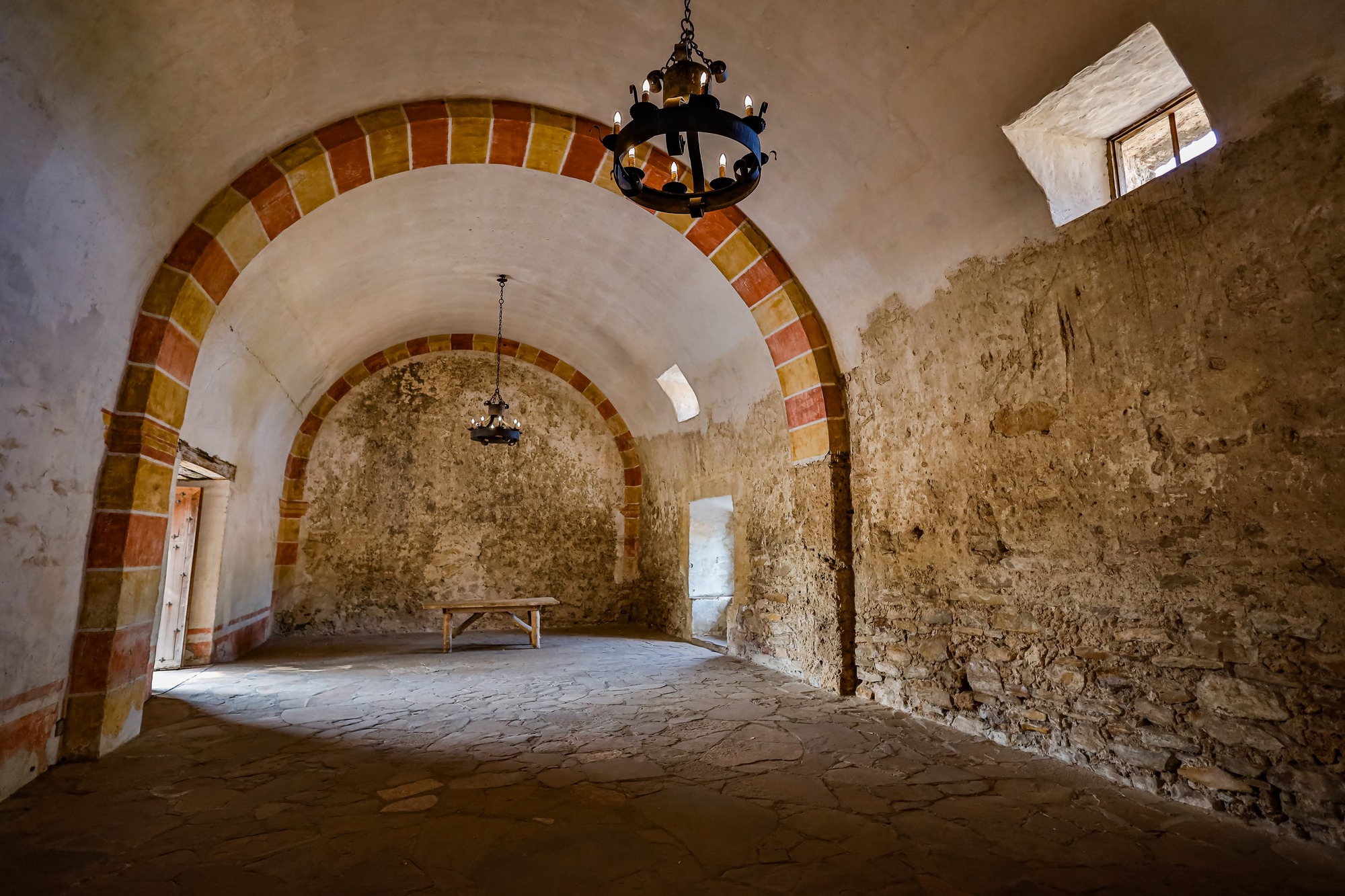 inside a room with an arched room