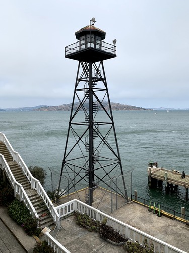 Tall metal guard tower overlooking the San Francisco bay.