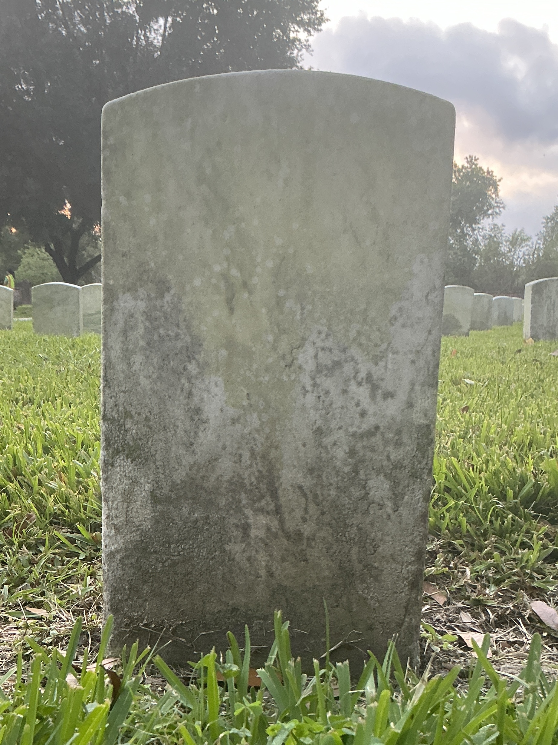 Extra image of historic upright marble headstone with recessed shield face.