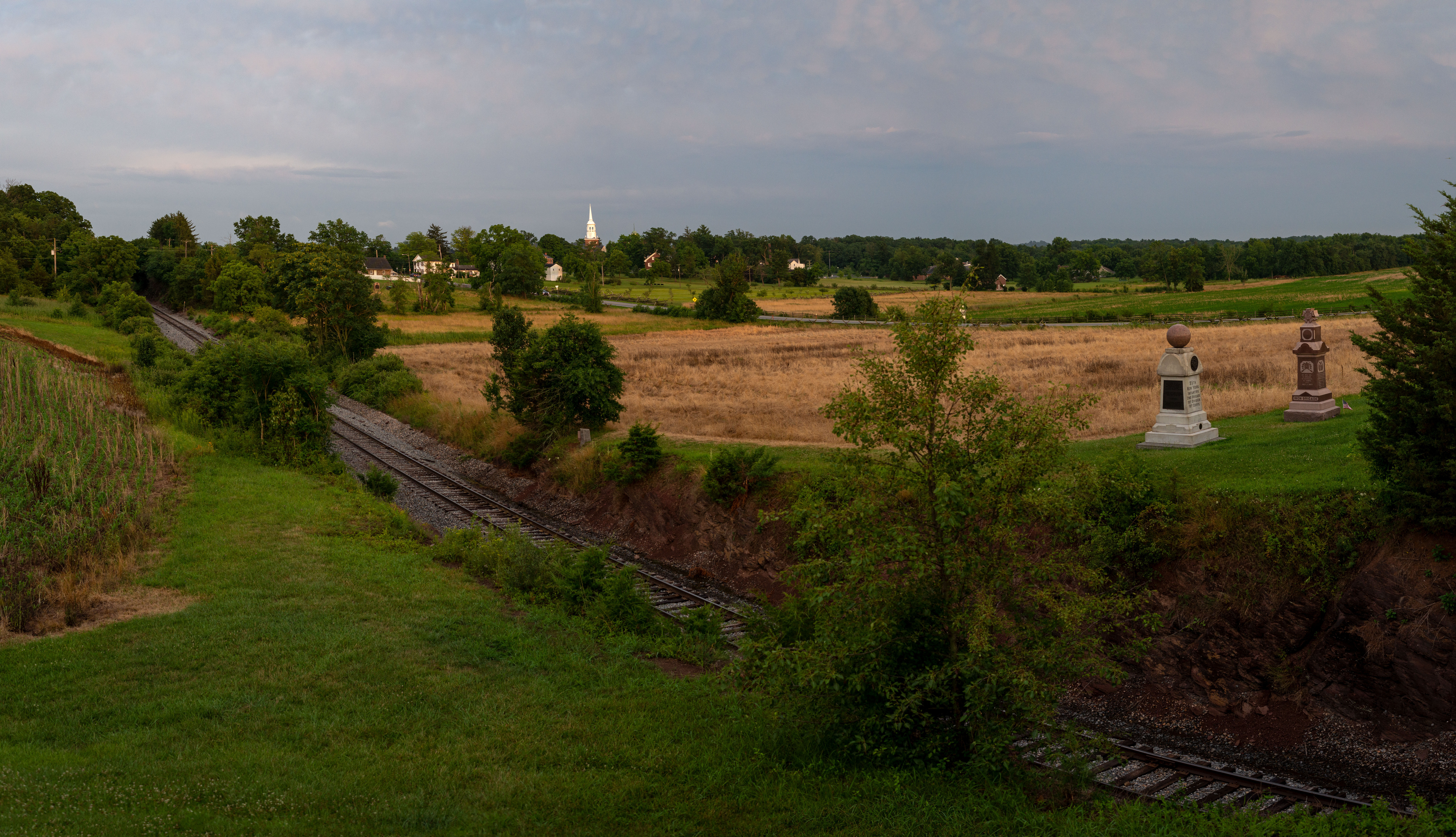 A railroad track leading into a small town.
