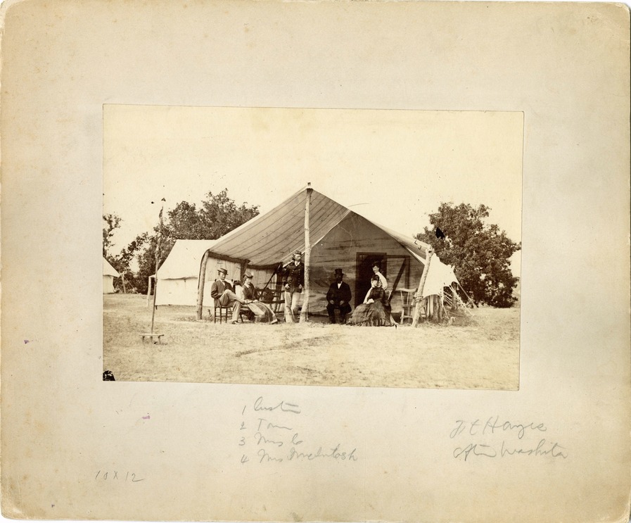 Group of People [left to right]: Thomas Ward Custer, Elizabeth Bacon Custer, George Armstrong Custer, and Mary McIntosh in the Front of a Tent, 7th Cavalry Camp on Big Creek, Near Fort Hays, Kansas