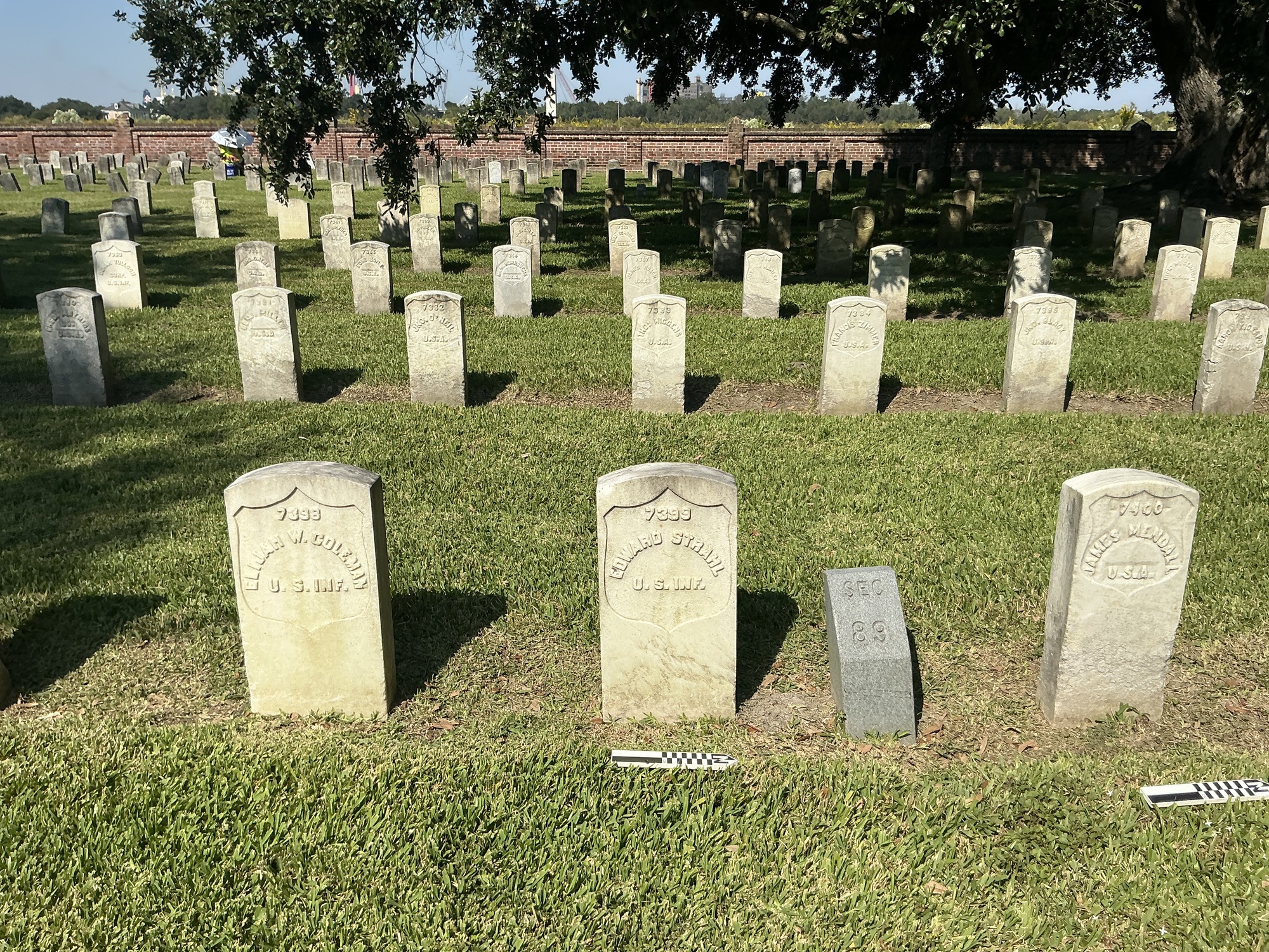 Extra image of historic upright marble headstone with recessed shield face.