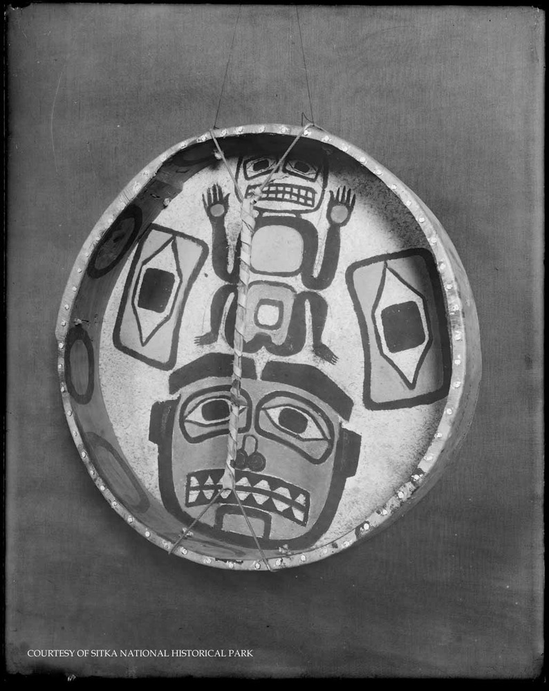 A view of the parade ground and buildings surrounding it, taken from a dock.