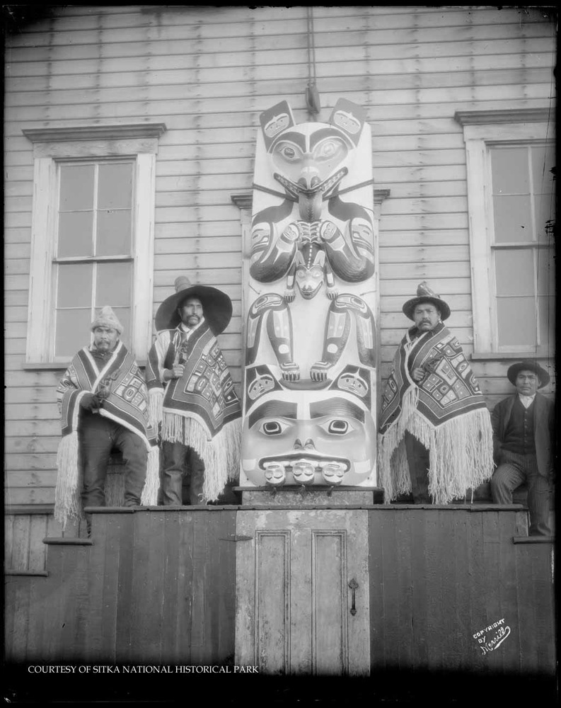 Congregants and clergy of the Russian Orthodox Church standing in front of the steps leading to the Russian Bishop's House.