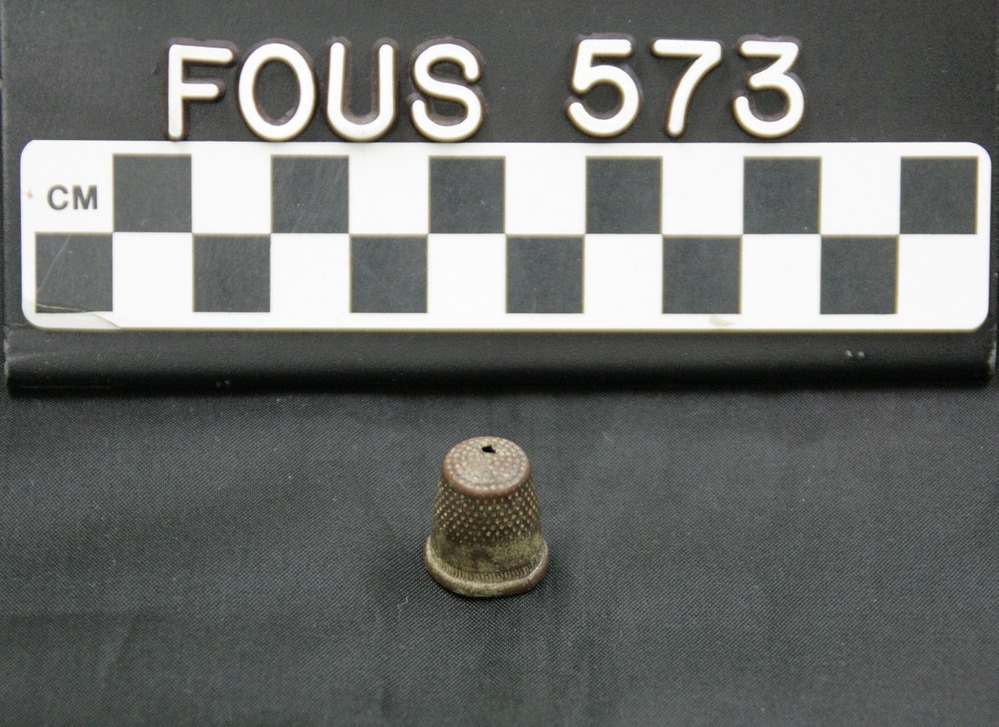 Brass thimble.