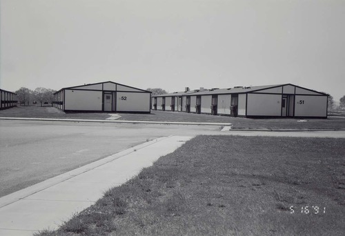 Barracks and parking area. Building numbers 51 and 52. [Image possibly for comparative housing study]