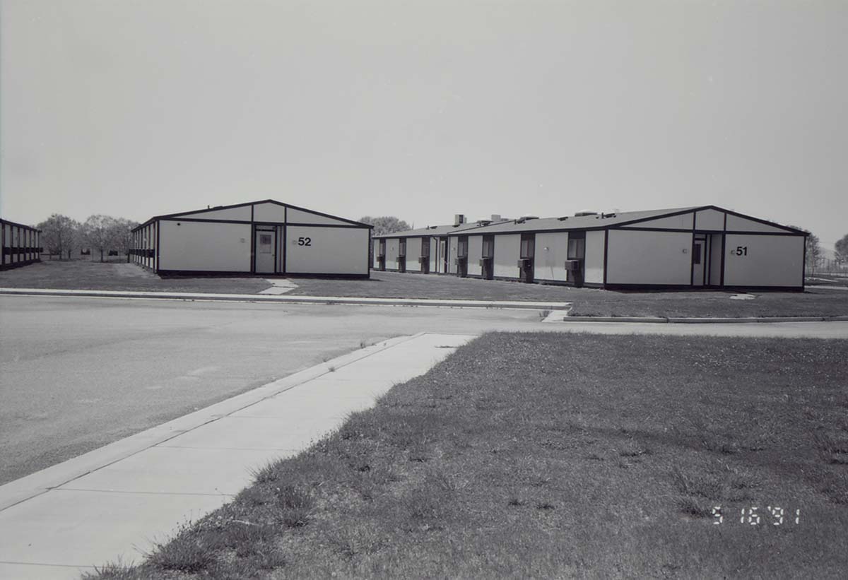 Barracks and parking area. Building numbers 51 and 52. [Image possibly for comparative housing study]