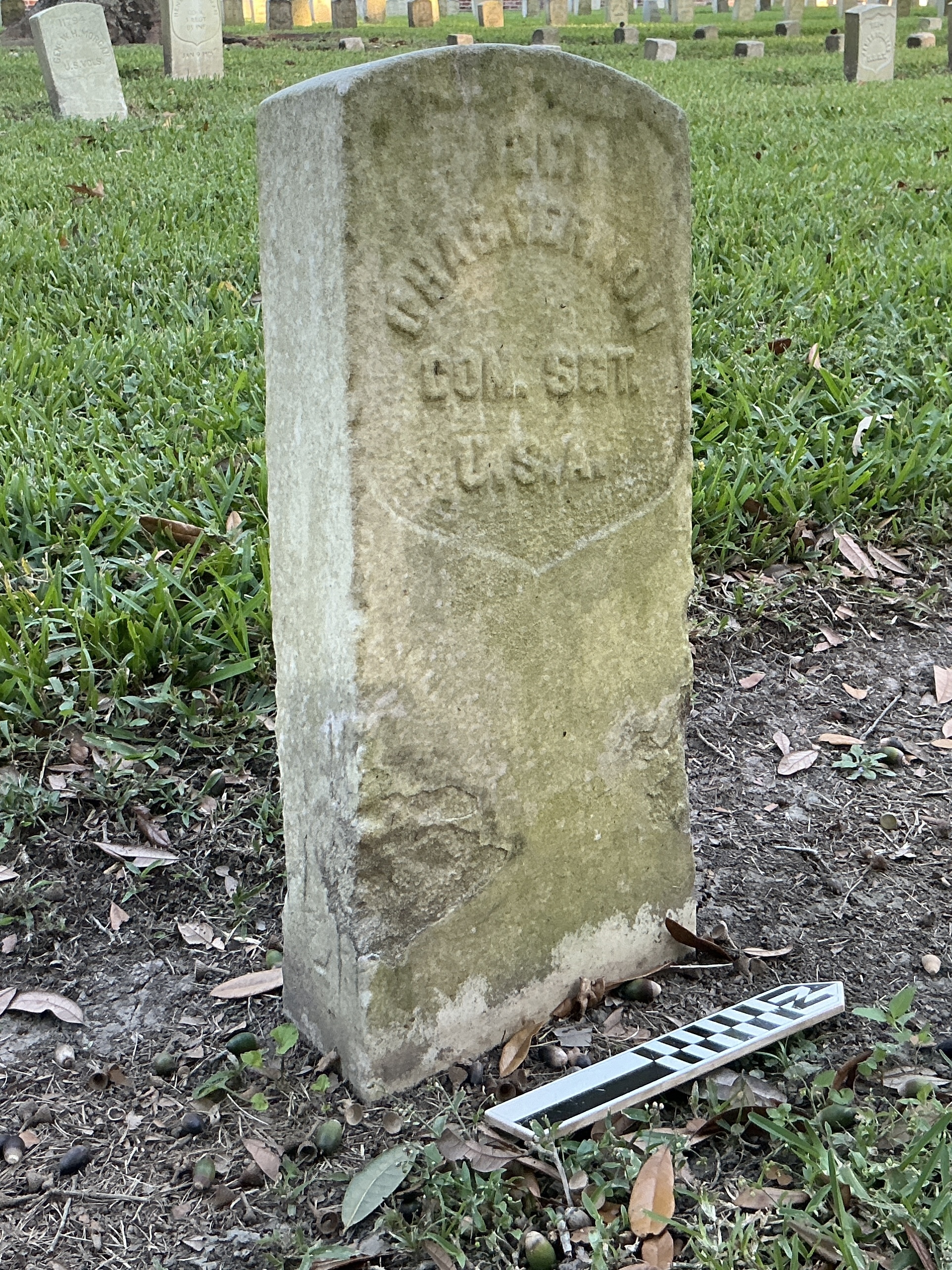 Extra image of historic upright marble headstone with recessed shield face.