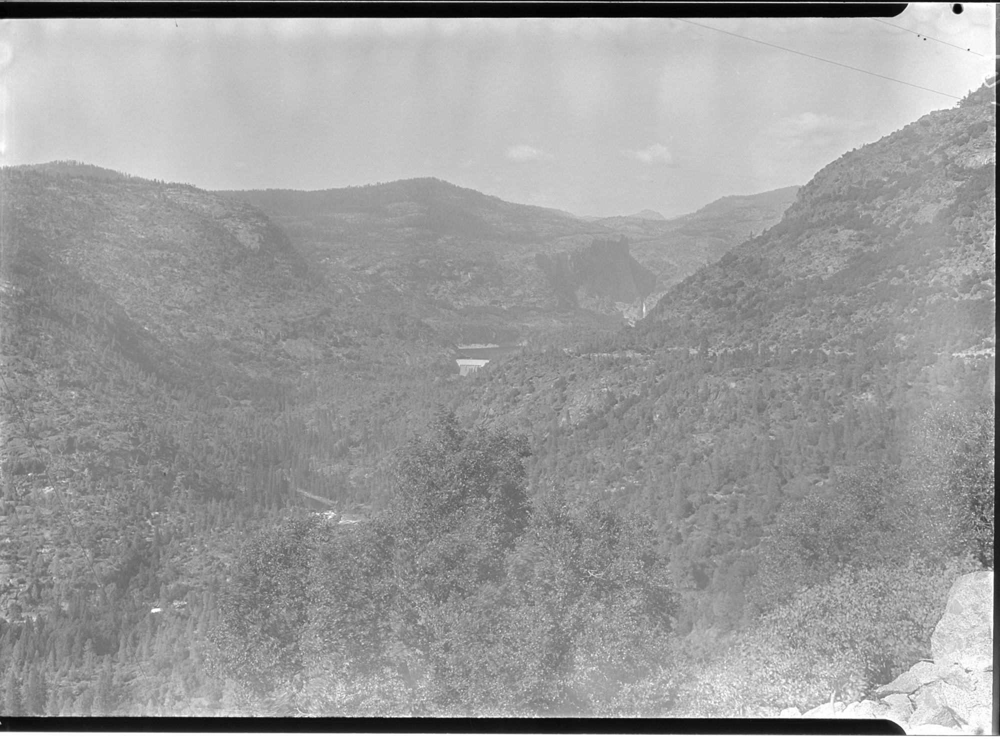 Hetch Hetchy Dam & reservoir from the road with Tuolumne rapids. 1/2 sec. F 64.