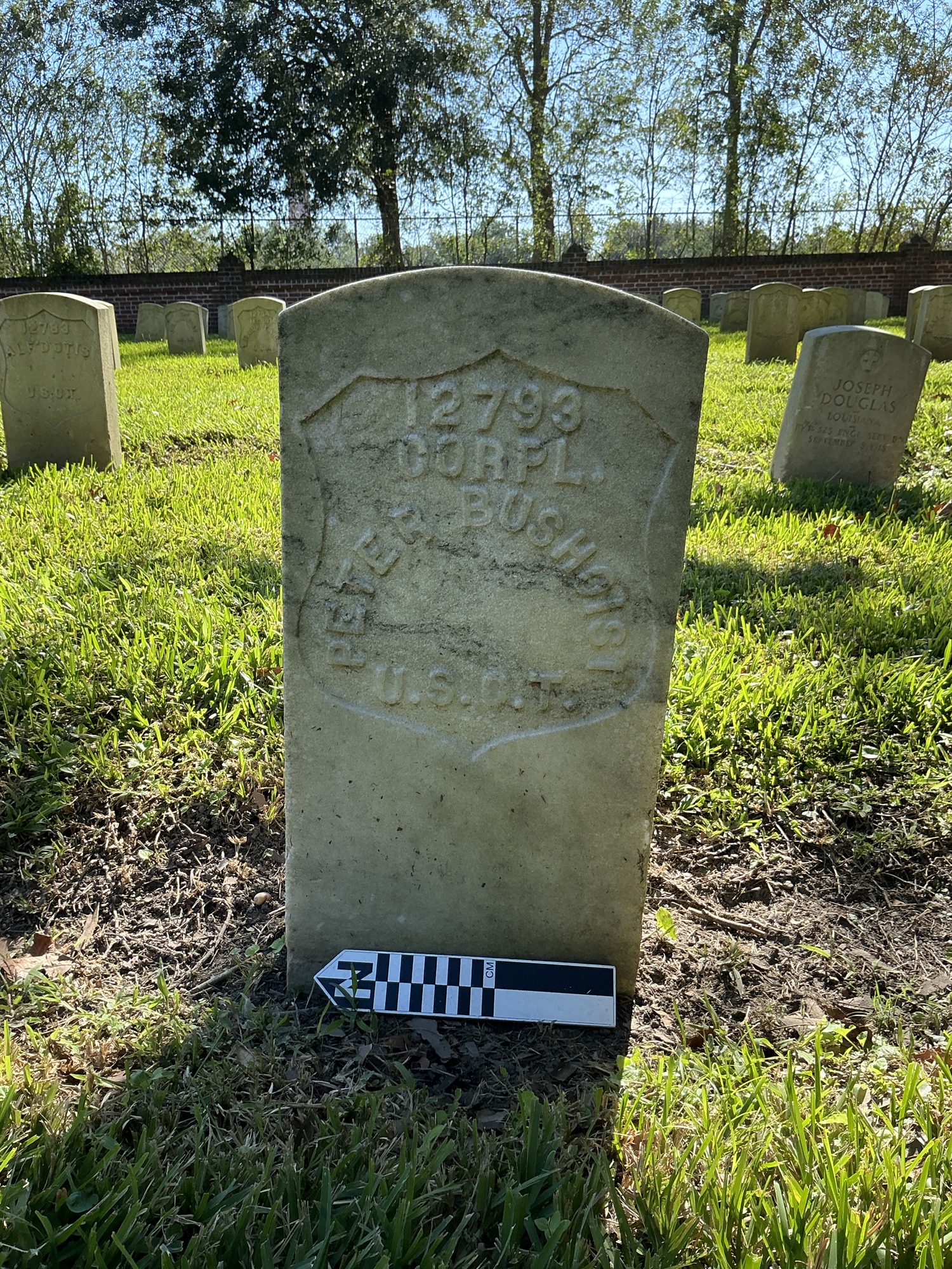 Extra image of historic upright marble headstone with recessed shield face.