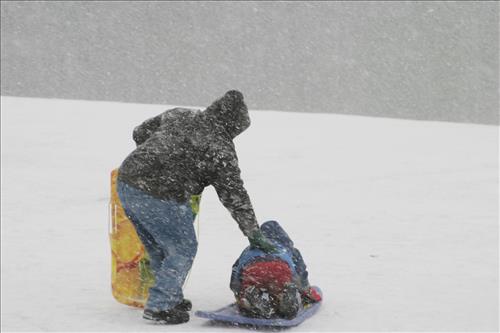 Sledding at Kendall Hills Adult and Child