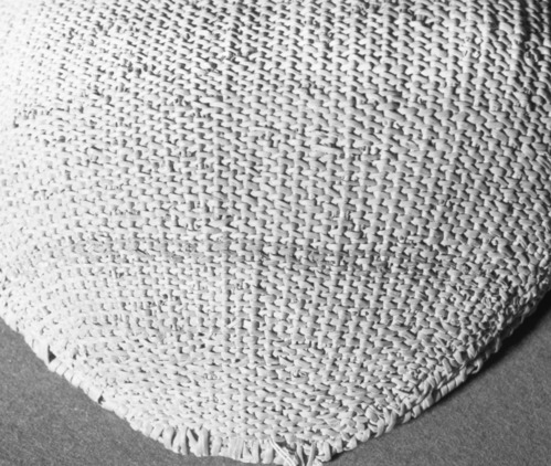 Private Collection. Object: Costanoan basket, exterior. Dimensions: 56 x 43 cm. Materials: sedgeroot, equisetum root, unidentified shoots, rimstick unid. (red bark). Technology: starts with one row of plain twining, up to right slant of turns, then row of bound weave, three rows of plain twining with alternate slants of turns, body of basket in diagonal twining, with one row of plain twining 13 cm from start, wrapped and stitched rim finish. Photographed by Michael Dixon. Catalogued by Craig Bates and Barbara Beroza. Yosemite Collections, National Park Service.