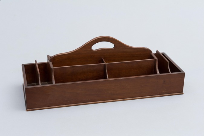 A wood box divided into twelve compartments with a carrying handle at top of center slat.