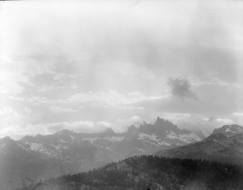 Minarets (under storm clouds) taken from road into the Postpiles.