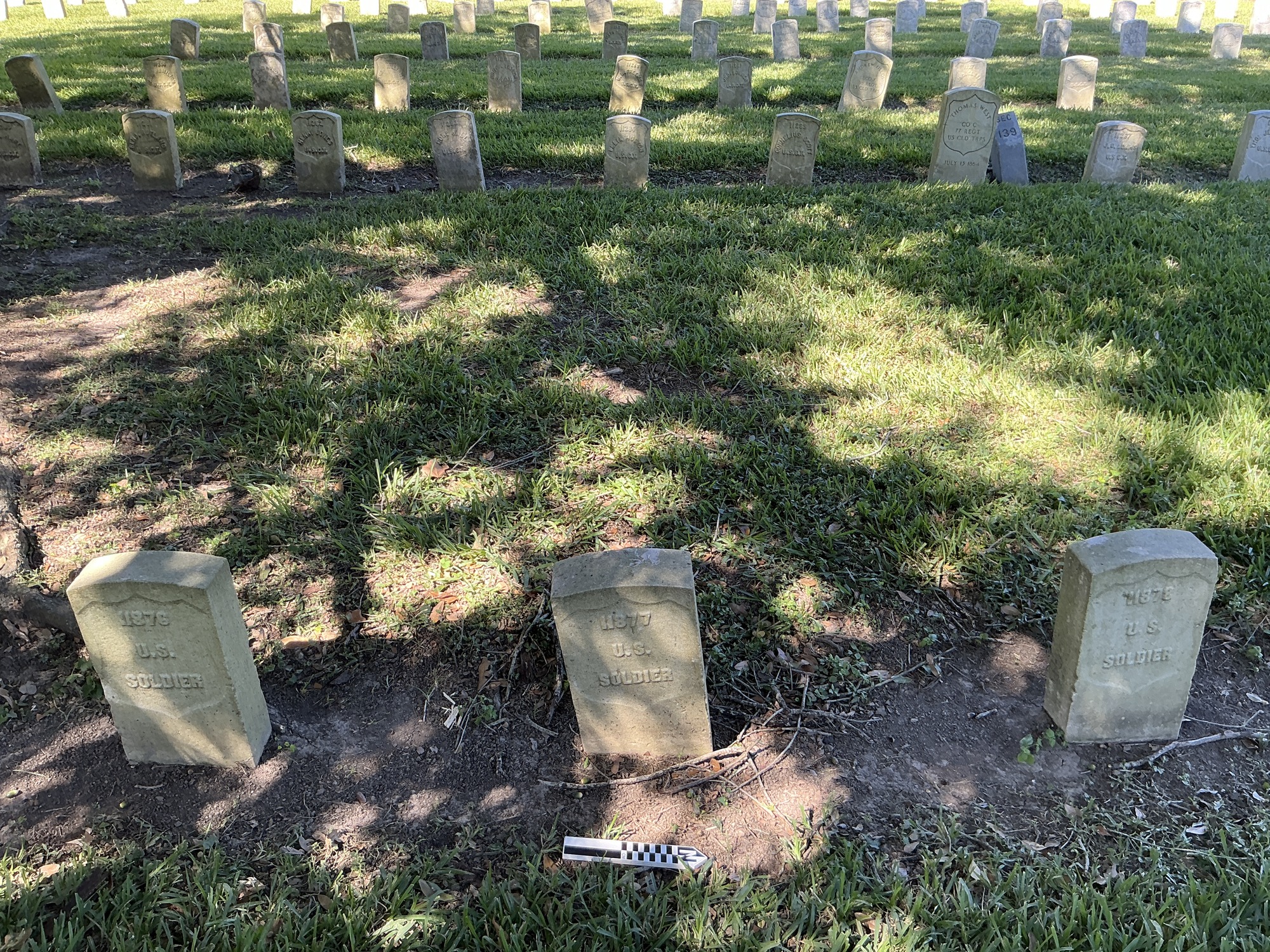 Extra image of historic upright marble headstone with recessed shield face.