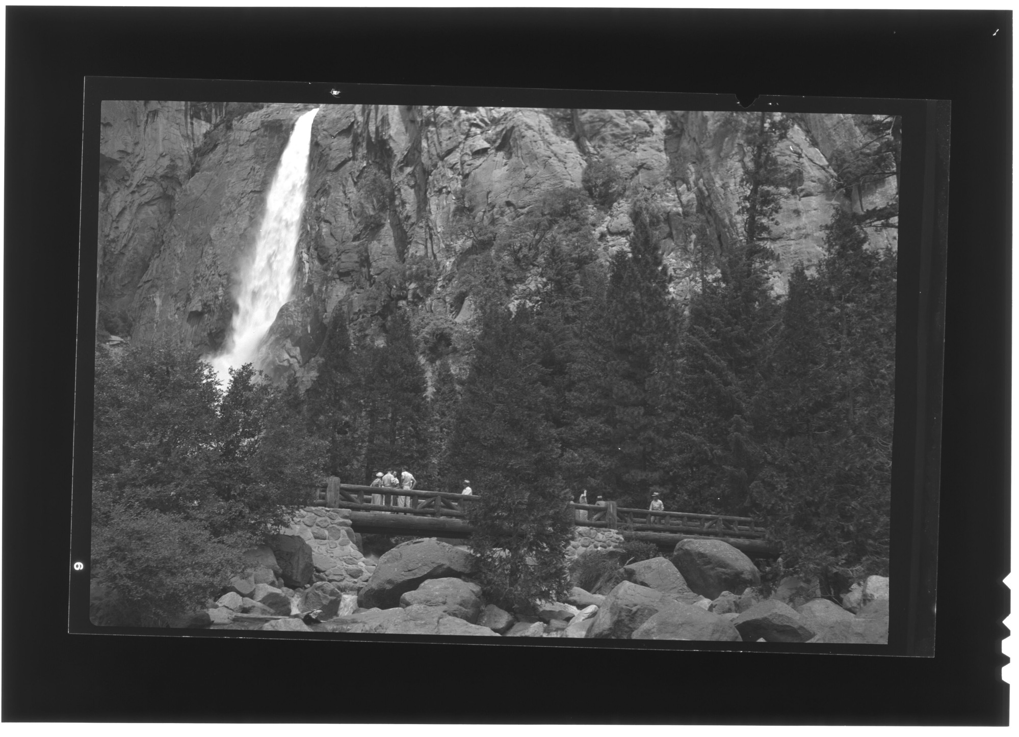 Crowd on bridge at Yosemite Falls.