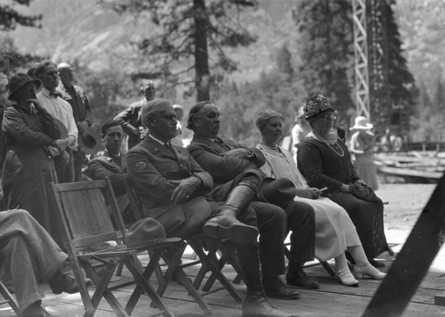 Laying of the cornerstone of the Ahwahnee. L-R: Director Stephen Mather, Gov. Richardson, Mrs. curry & Mrs. Richardson. [Seated behind Gov. Richardson, is Park Naturalist Bert Harwell.]
