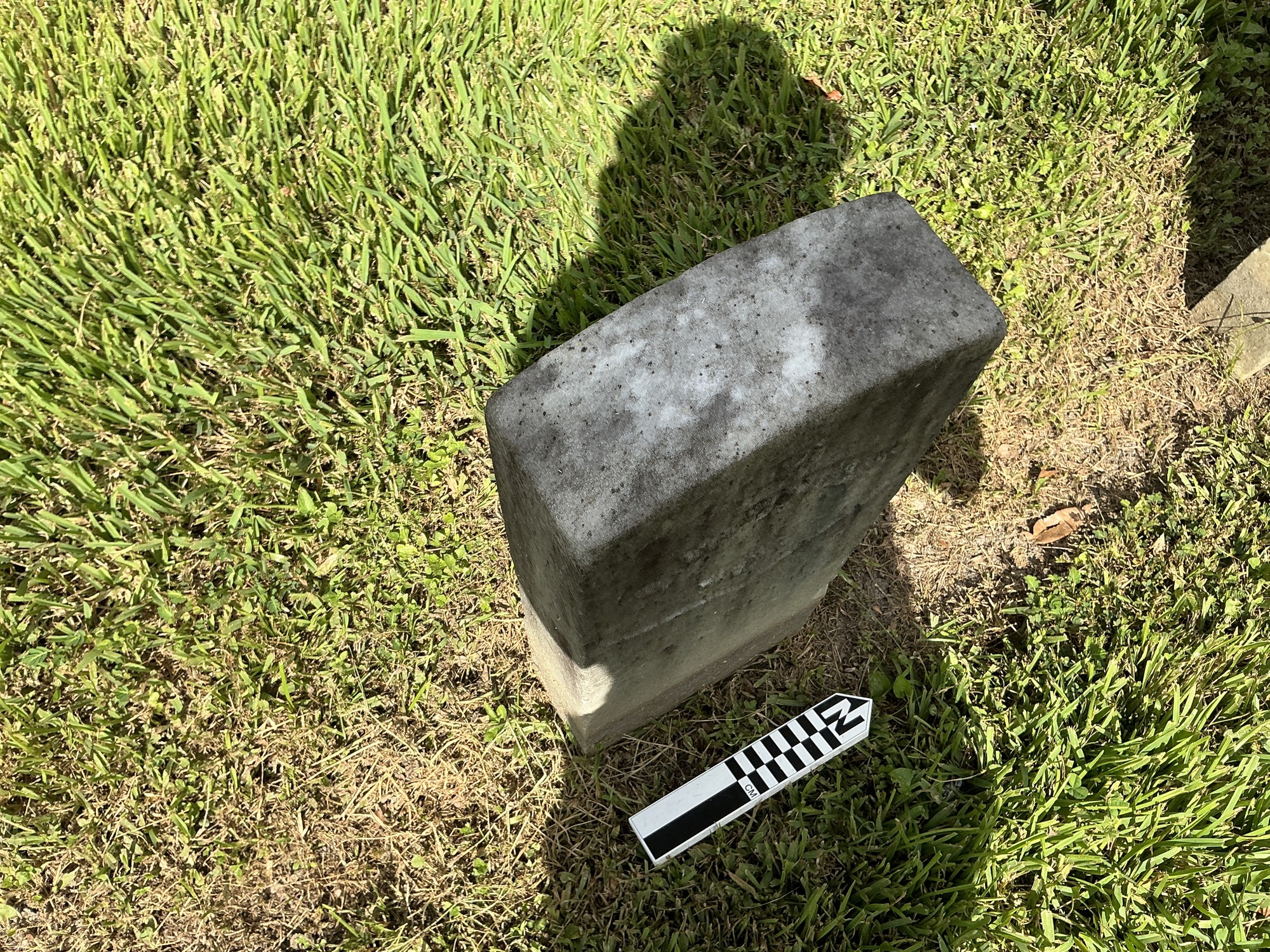 Extra image of historic upright marble headstone with recessed shield with recessed lettering face.