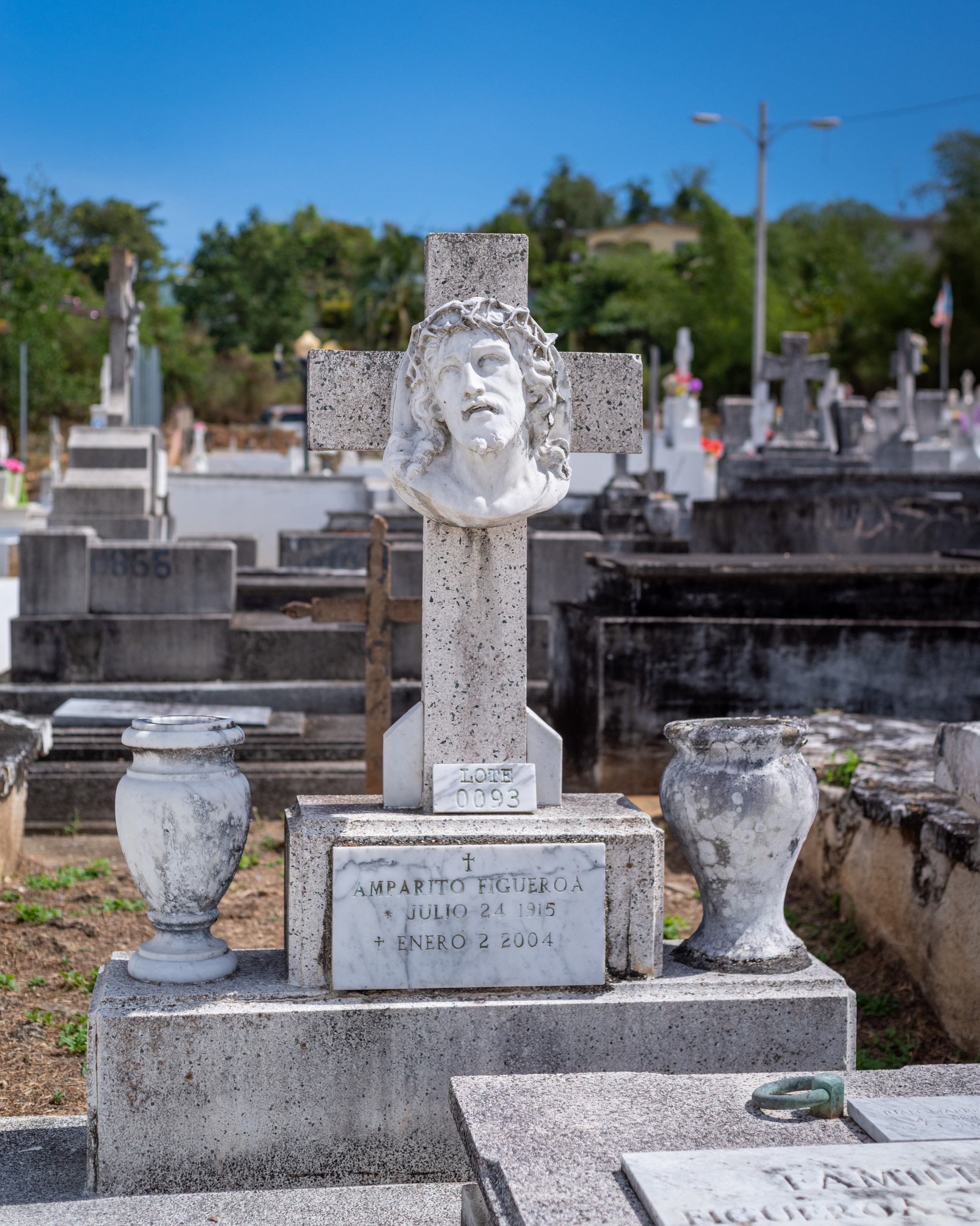 Stone cross with carved portrait of Jesus