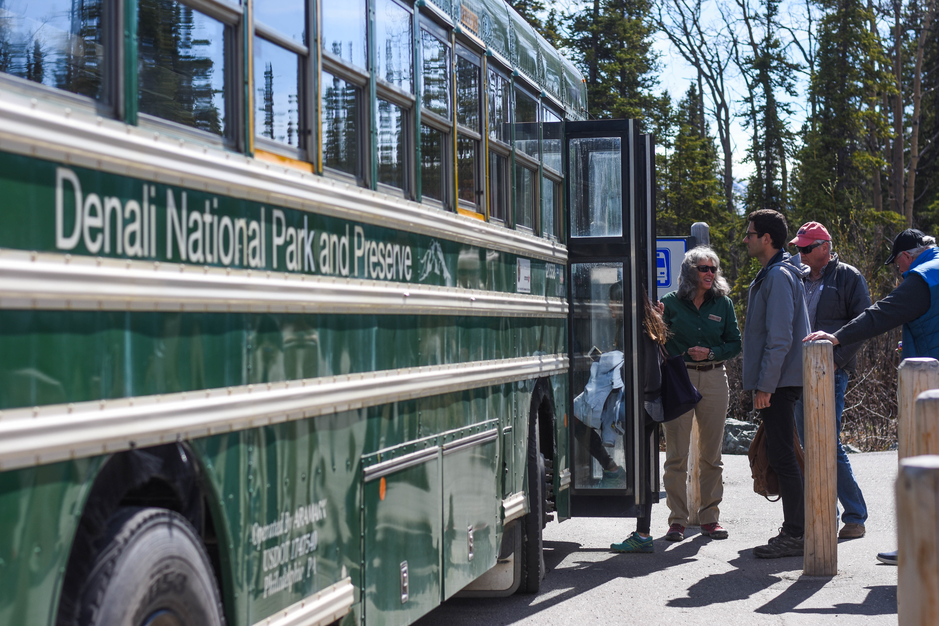 people boarding a bus