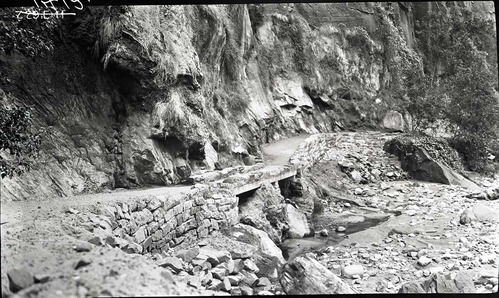 Narrows Trail construction, concrete slab footbridge with rock parapet.