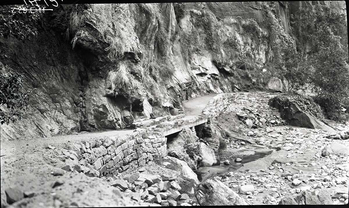 Narrows Trail construction, concrete slab footbridge with rock parapet.
