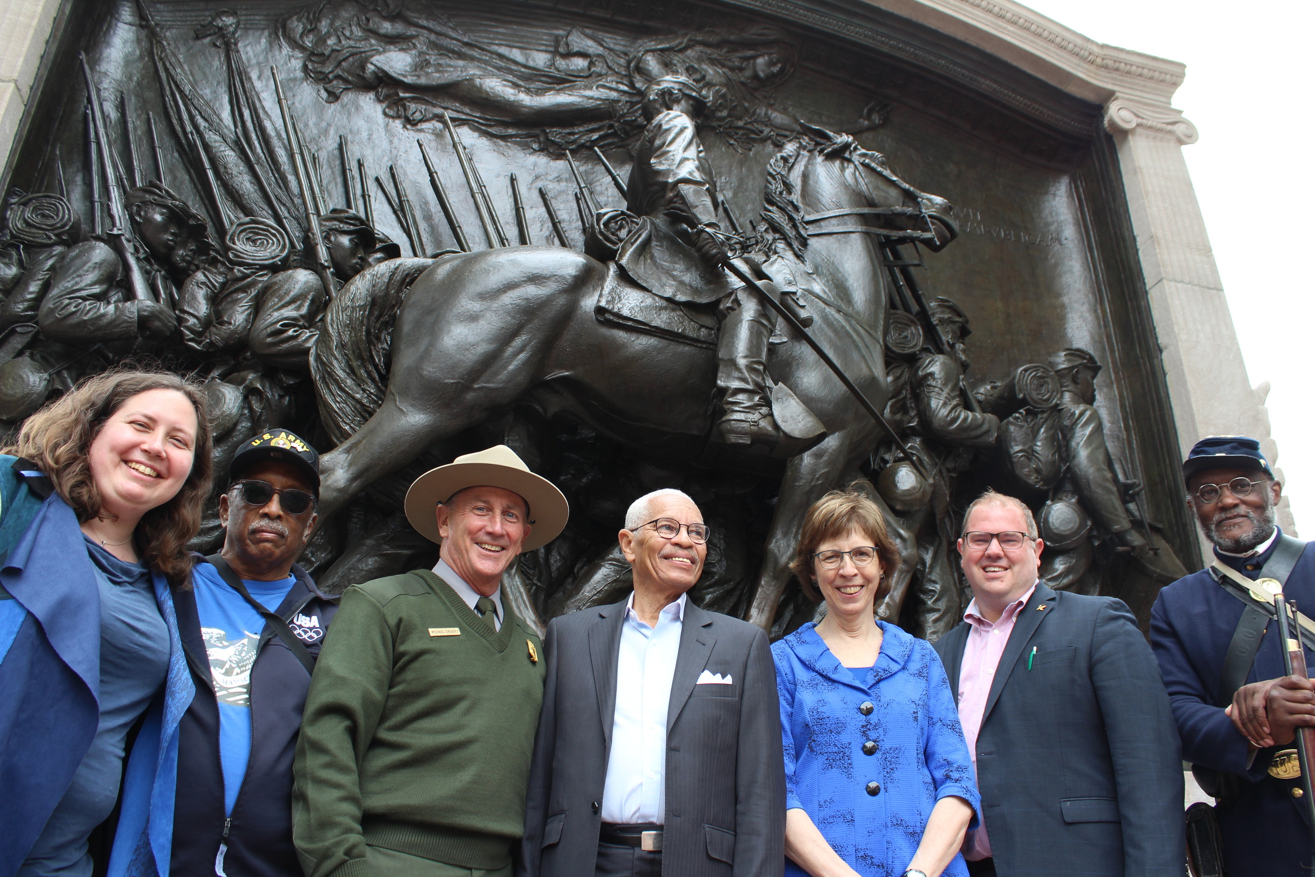 Members of the Partnership to Renew the Shaw/54th Memorial standing in front of the restored Memorial. 