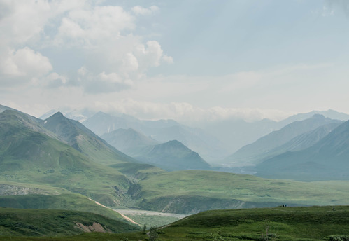 mountainous landscape filled with low smokey haze